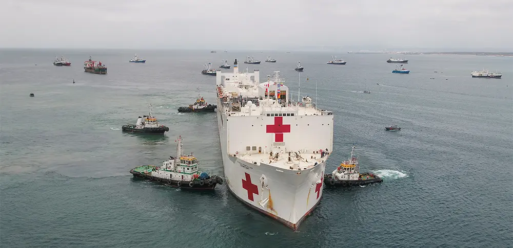 Four Ecuaestibas tugs assist with berthing of large hospital ship in Ecuador